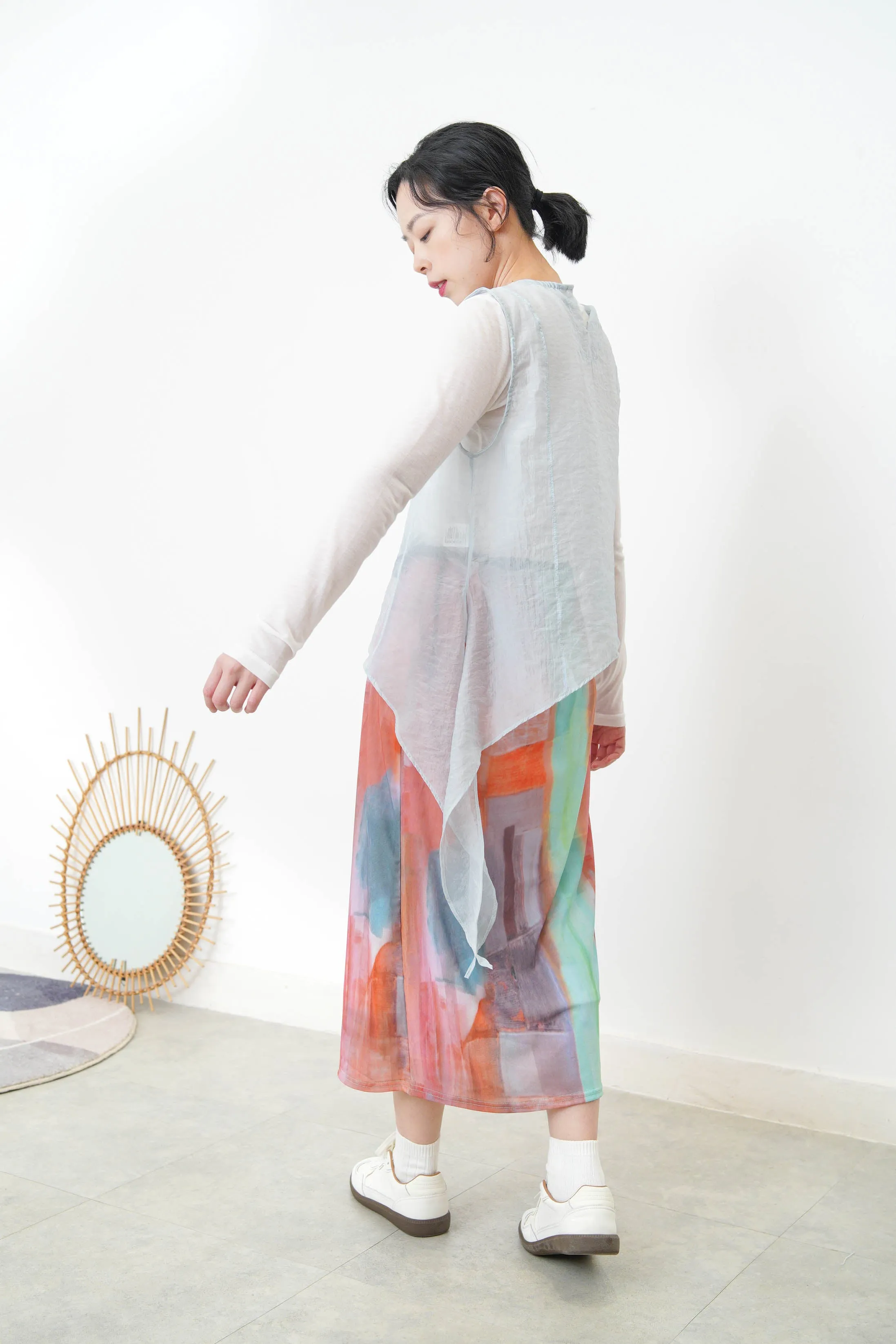 Baby blue sheer vest in asymmetrical cut
