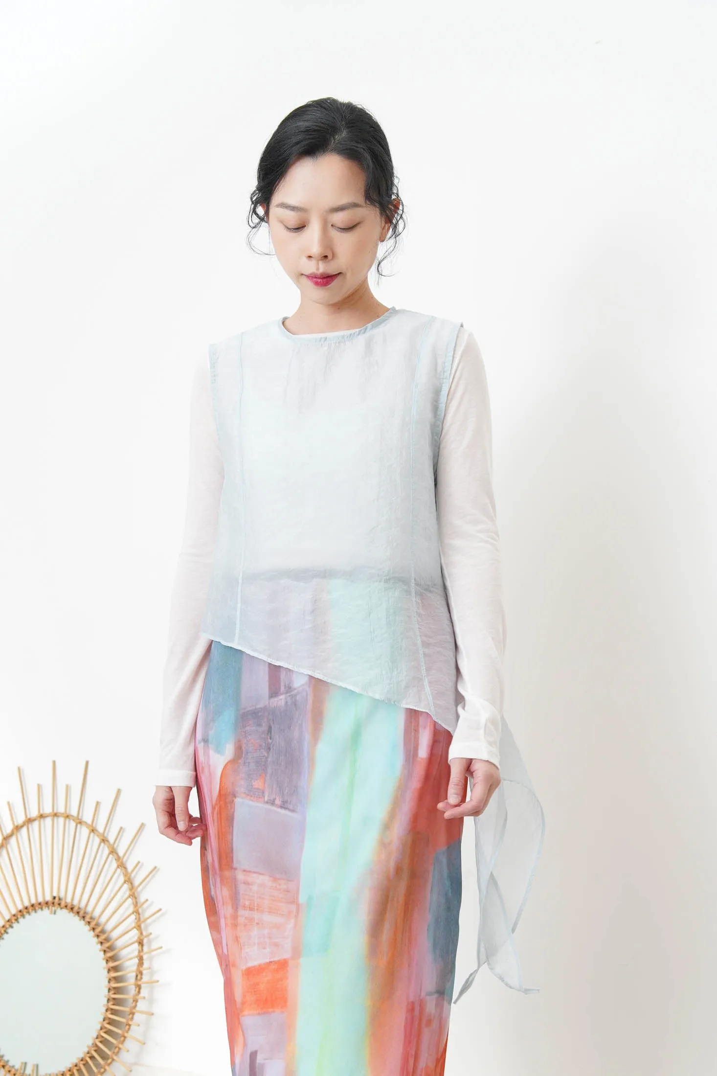Baby blue sheer vest in asymmetrical cut