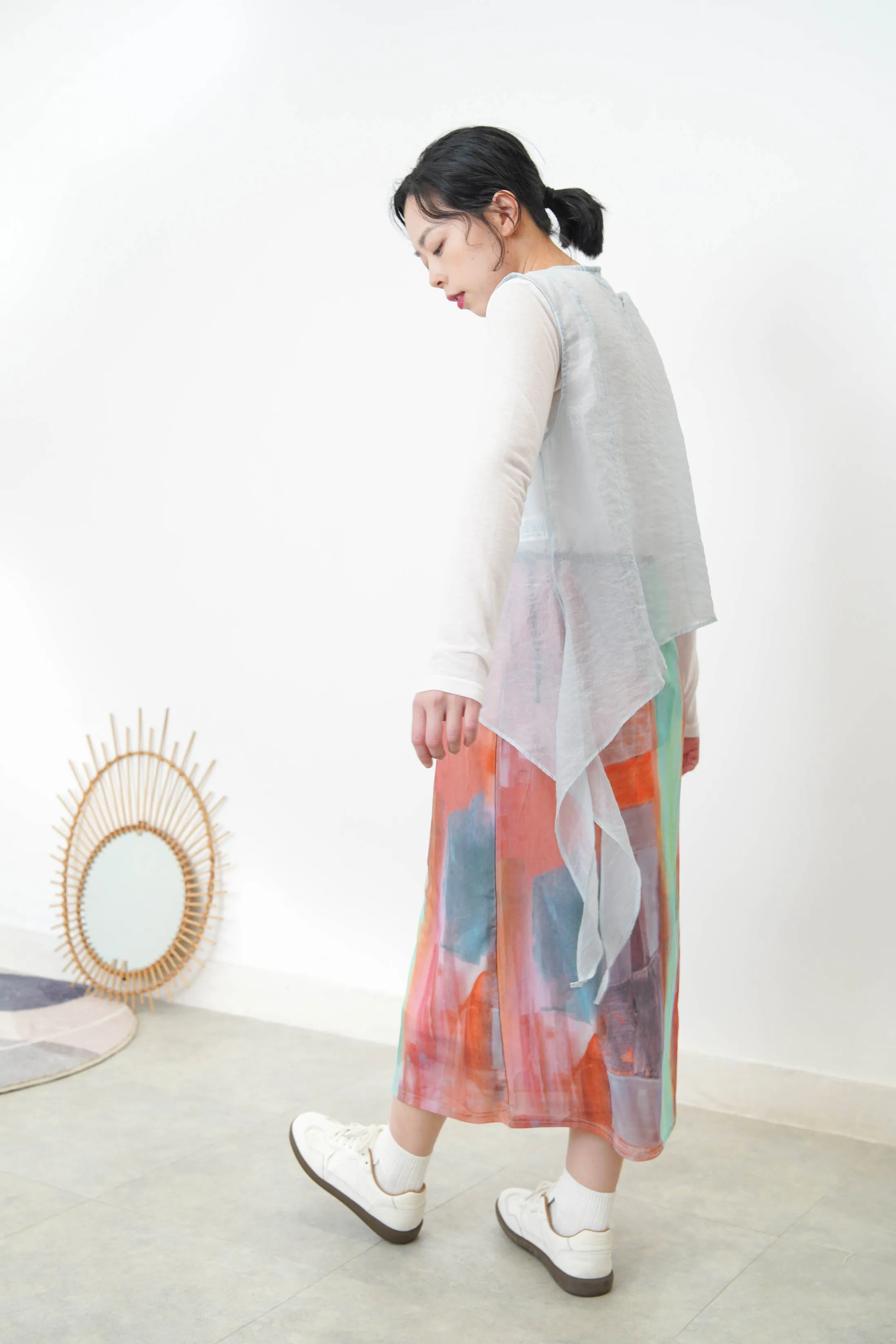 Baby blue sheer vest in asymmetrical cut